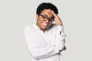 young black woman with glasses uncomfortable with question