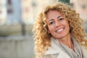 Smiling woman with no visible dental problems