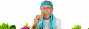Closeup Old Man Bites Carrot