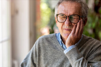 Old man in tooth pain