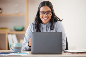 smiling woman with laptop