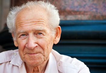 face portrait of a cheerful smiling senior man