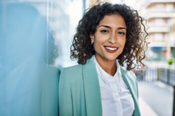 hispanic business woman wearing professional look smiling confident