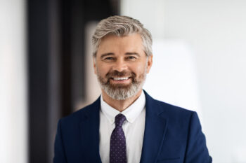 Man in suit smiling