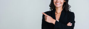 Woman pointing finger in business suit