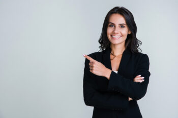 Woman pointing finger in business suit