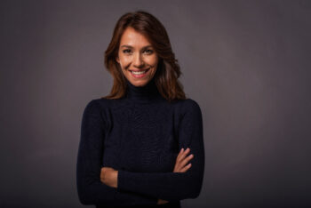 Woman smiling in black sweater