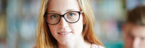 Girl in glasses looking in camera